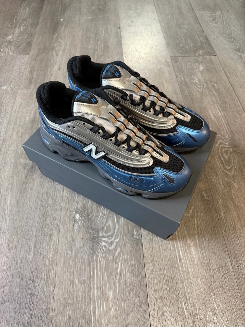 New Balance Men’s 1000 Metallic Blue & Silver Sneakers - Picture 2 of 8